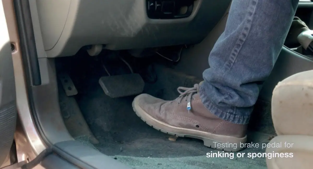 Testing brake pedal for sinking or sponginess